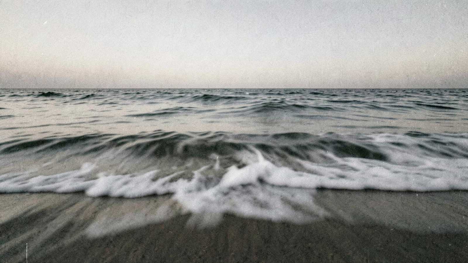 Wind moving across the surface of the ocean at dawn